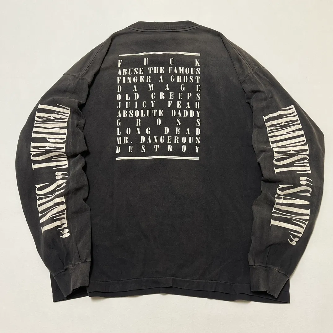 SAINT Mxxxxxx LS TEE/TEMPEST/BLK 'TEMPEST SAINT' Storm Religious Saints Cracked Retro Vulcanized Heavy Wash Long Sleeves Washed Black S-XL Assute Dyeing Multi-bit Horse Fading Craftsmanship Grinding and Hanging Holes Full of Old Feeling Top Printing Craftsmanship Purchasing Level